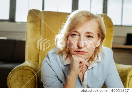 Adult short-haired woman with blue eyes being unhappy and depressed 49051867