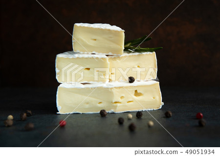 Cheese camembert or brie with fresh rosemary 49051934