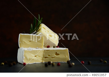 Cheese camembert or brie with fresh rosemary 49051957