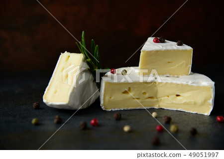 Cheese camembert or brie with fresh rosemary Cheese camembert or brie with fresh rosemary 49051997
