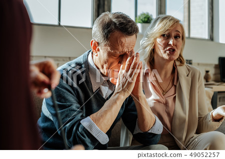 Distressed old man being depressed with situation in his family 49052257