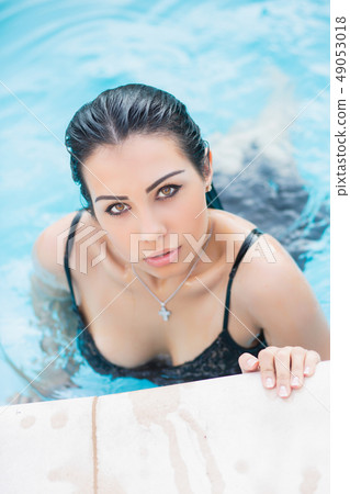 Portrait of a young beautiful brunette. 49053018