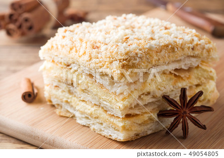 Layered cake with cream Napoleon millefeuille Layered cake with cream Napoleon millefeuille 49054805