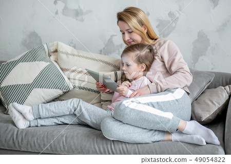 Beautiful young mother and her little daughter Beautiful young mother and her little daughter 49054822