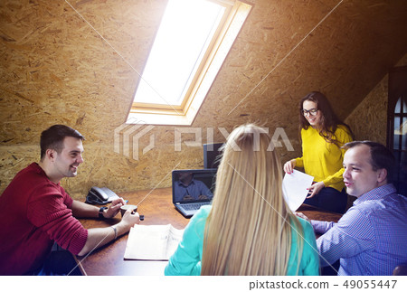 Business team at work with financial reports 49055447