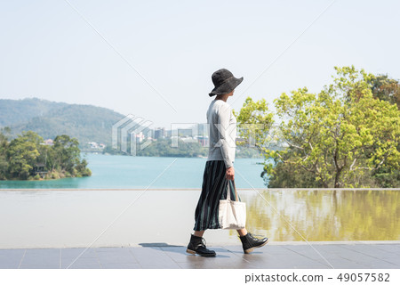 traveling woman walk at Xiangshan Visitor Center traveling woman walk at Xiangshan Visitor Center 49057582
