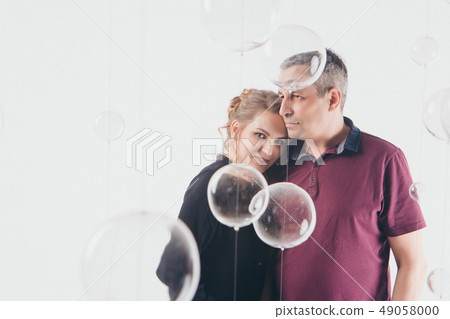 couple in love hugs on white background. man and couple in love hugs on white background. man and 49058000