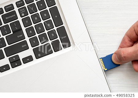 Inserting SD card Inserting SD card 49058325