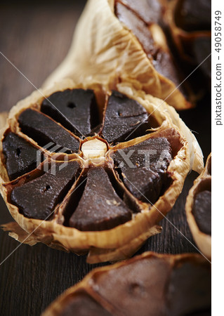 Black garlic wood grain background 49058749