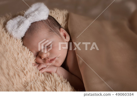 the face of a child with a bandage on his head the face of a child with a bandage on his head 49060384