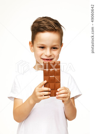 little beautiful boy holding chocolate studio shot little beautiful boy holding chocolate studio shot 49060642