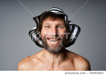 Funny portrait of mature man topless wearing summer hat Funny portrait of mature man topless wearing summer hat 49060964