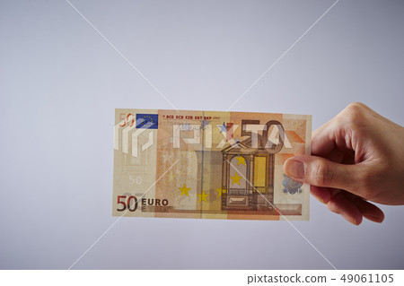 Female hand with fifty euro banknote 49061105