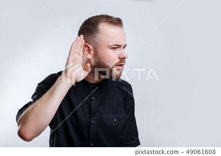 Businessman hold his hand near ear for listening carefully 49061608