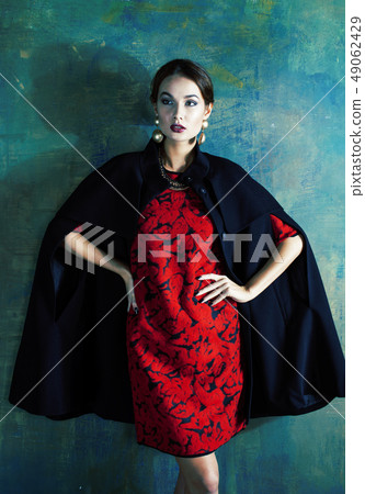 beauty rich brunette woman with a lot of jewellery, hispanic curly lady in rich luxury interior 49062429