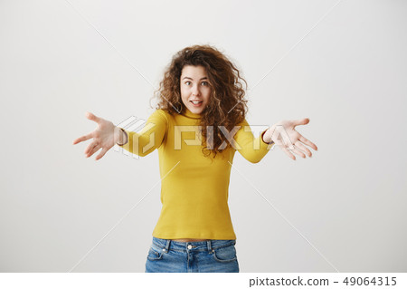 Surprised happy beautiful woman looking excitement. Isolated on gray background 49064315
