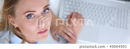 Beautiful smiling businesswoman portrait at workplace Beautiful smiling businesswoman portrait at workplace 49064991