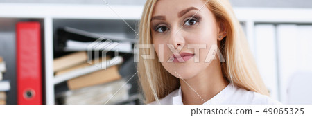 Beautiful smiling businesswoman portrait at workplace Beautiful smiling businesswoman portrait at workplace 49065325