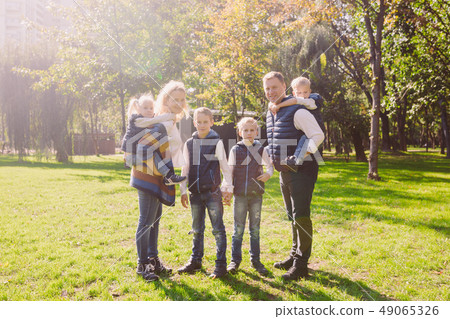 Theme family active leisure outside in nature. large Caucasian family with four children. Mom and Theme family active leisure outside in nature. large Caucasian family with four children. Mom and 49065326