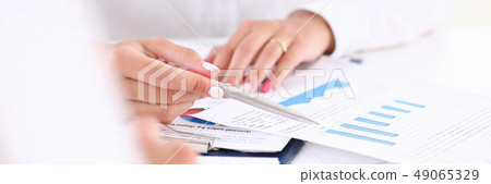 Businesswoman holding a silvery pen 49065329