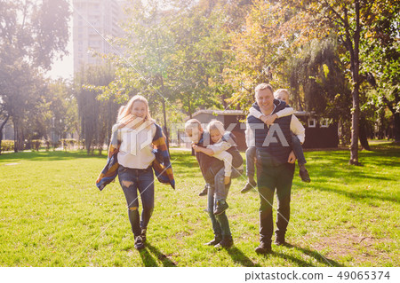 Theme family active leisure outside in nature. large Caucasian family with four children. Mom and Theme family active leisure outside in nature. large Caucasian family with four children. Mom and 49065374