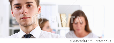 Handsome smiling businessman in suit portrait Handsome smiling businessman in suit portrait 49065393