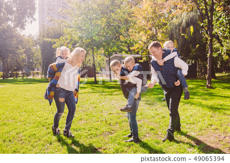 Theme family active leisure outside in nature. large Caucasian family with four children. Mom and Theme family active leisure outside in nature. large Caucasian family with four children. Mom and 49065394