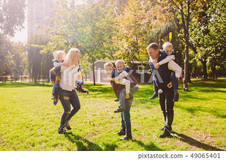 Theme family active leisure outside in nature. large Caucasian family with four children. Mom and Theme family active leisure outside in nature. large Caucasian family with four children. Mom and 49065401