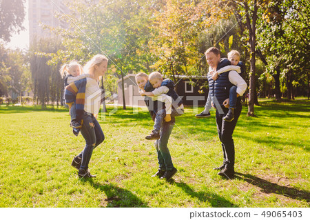 Theme family active leisure outside in nature. large Caucasian family with four children. Mom and 49065403