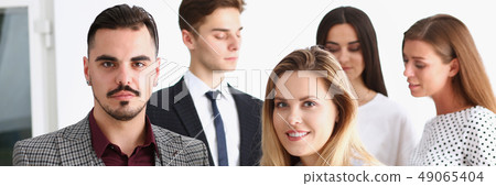 Group of smiling people stand in office 49065404