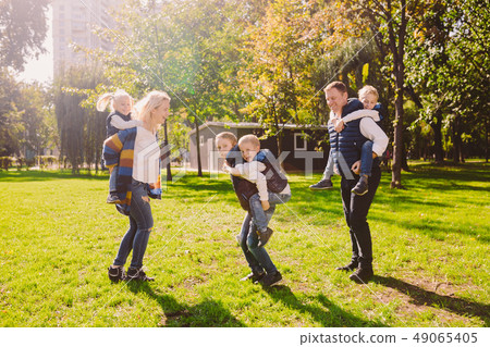 Theme family active leisure outside in nature. large Caucasian family with four children. Mom and 49065405