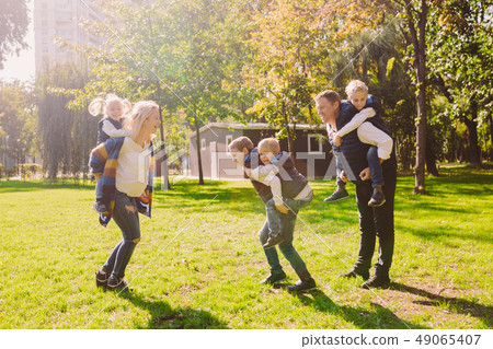 Theme family active leisure outside in nature. large Caucasian family with four children. Mom and Theme family active leisure outside in nature. large Caucasian family with four children. Mom and 49065407