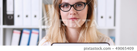 Beautiful businesswoman wearing glasses Beautiful businesswoman wearing glasses 49065409
