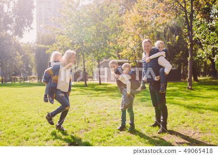 Theme family active leisure outside in nature. large Caucasian family with four children. Mom and Theme family active leisure outside in nature. large Caucasian family with four children. Mom and 49065418