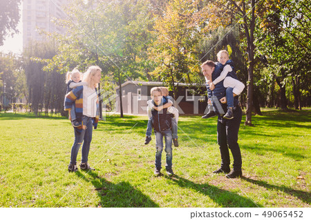 Theme family active leisure outside in nature. large Caucasian family with four children. Mom and Theme family active leisure outside in nature. large Caucasian family with four children. Mom and 49065452