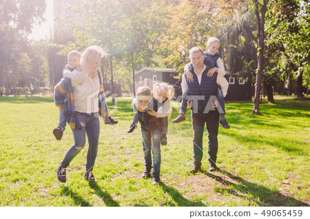 Theme family active leisure outside in nature. large Caucasian family with four children. Mom and 49065459