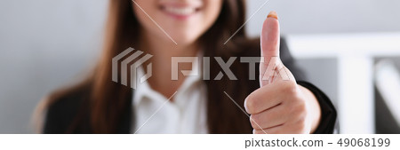 Beautiful smiling woman showing ok or approval Beautiful smiling woman showing ok or approval 49068199