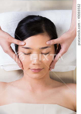 Ayurvedic Head Massage Therapy on facial forehead Ayurvedic Head Massage Therapy on facial forehead 49069382