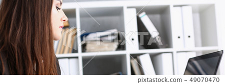 Female hand holding silver pen ready to make 49070470