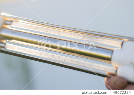 hand holds the measuring device for weather  49072254