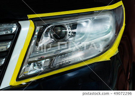 Car headlights with power buffer machine at servic 49072296