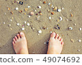 Feet putting on sand beach for relaxing  49074692