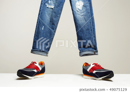 Fashionable sneakers and jeans set Fashionable sneakers and jeans set 49075129