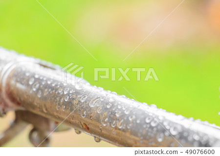 water drops on old metallic steel pipe aluminum 49076600