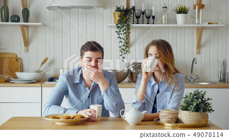 sad couple girl guy have breakfast drinking tea silently 49078114