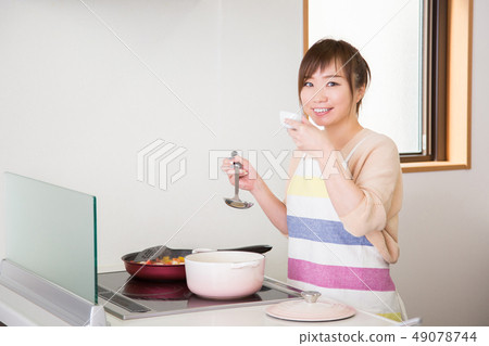 Woman tasting Woman tasting 49078744