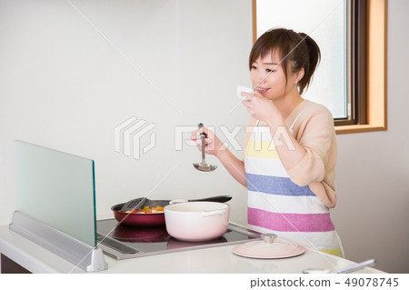 Woman tasting Woman tasting 49078745