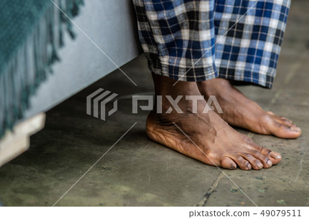 Close up of feet touching the floor Close up of feet touching the floor 49079511