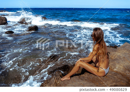 Sexy young girl in the ocean posing Sexy young girl in the ocean posing 49080829