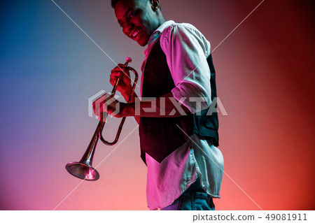 African American jazz musician playing trumpet. African American jazz musician playing trumpet. 49081911